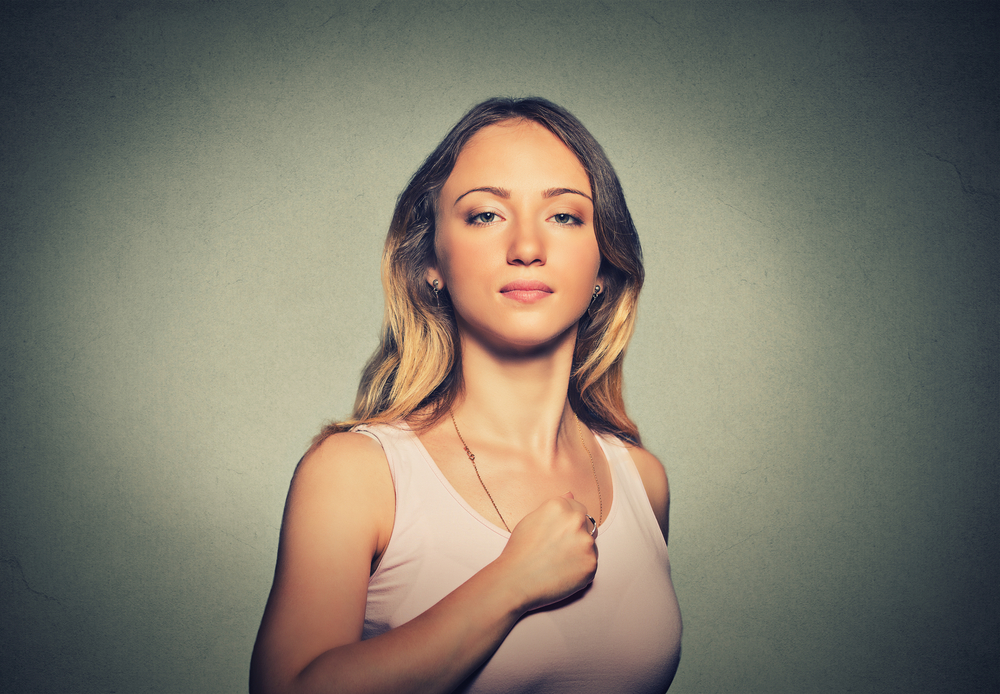 Superhero,Girl.,Confident,Young,Woman,Isolated,On,Gray,Wall,Background